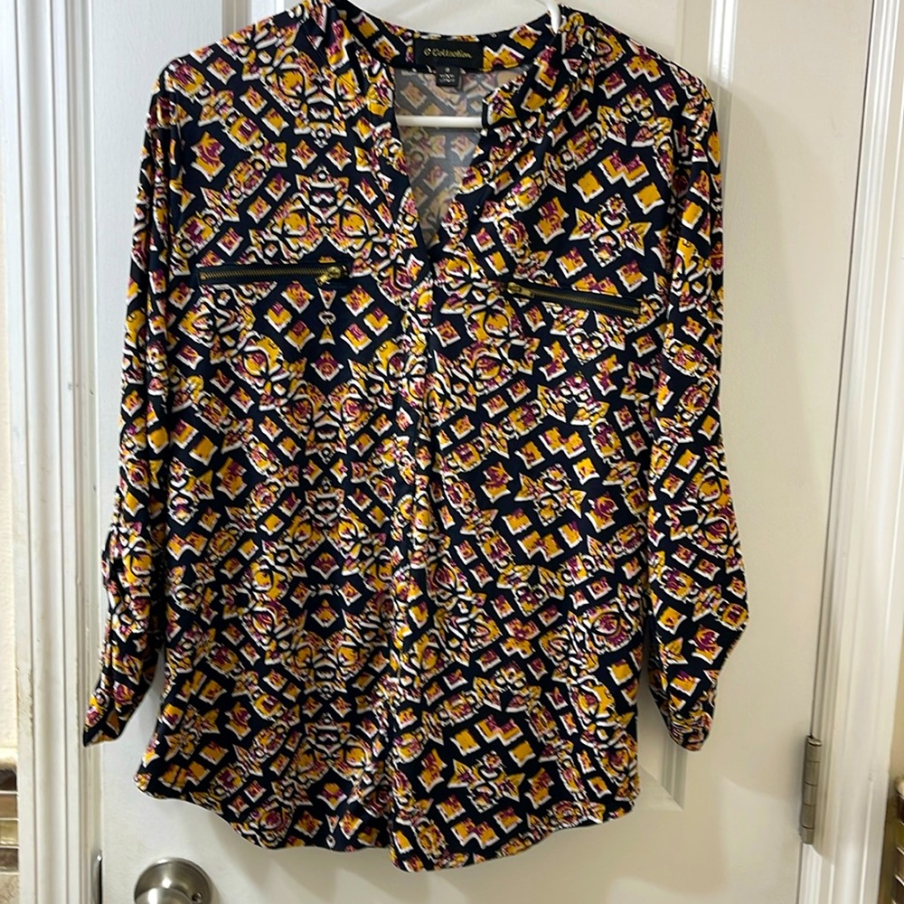 G Collection top. Black with goldenrod/plum/white geometric pattern. Size M.